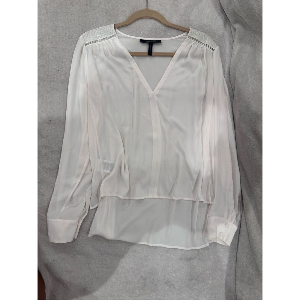 BCBG white long sleeve blouse size M with sequins on shoulders